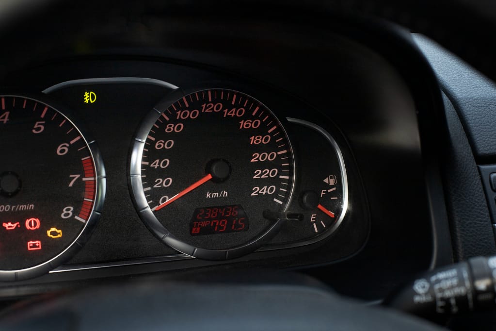 Dashboard of a high-mileage car, Eco Recycle offers tips for selling vehicles with high odometer readings.